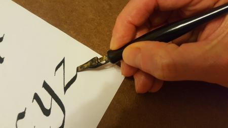 hand doing calligraphy