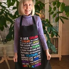Pam wearing an apron