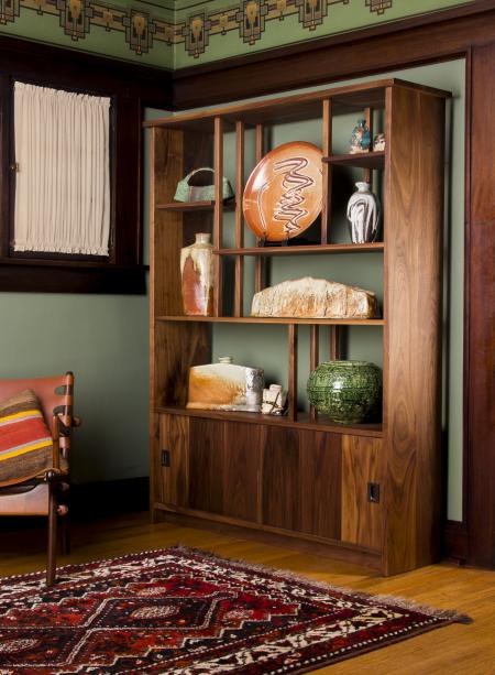 a wooden cabinet with other pieces of art made from art