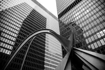 A photograph of two buildings and a sculpture in downtown Chicago